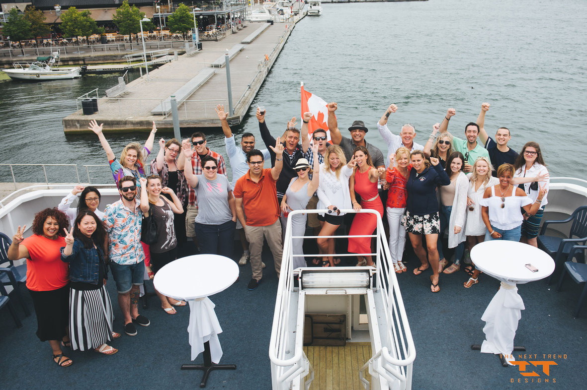 The TNT team together on a company boat cruise